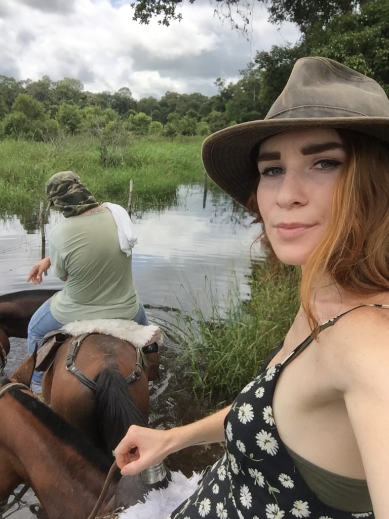 Riding a horse through the field
